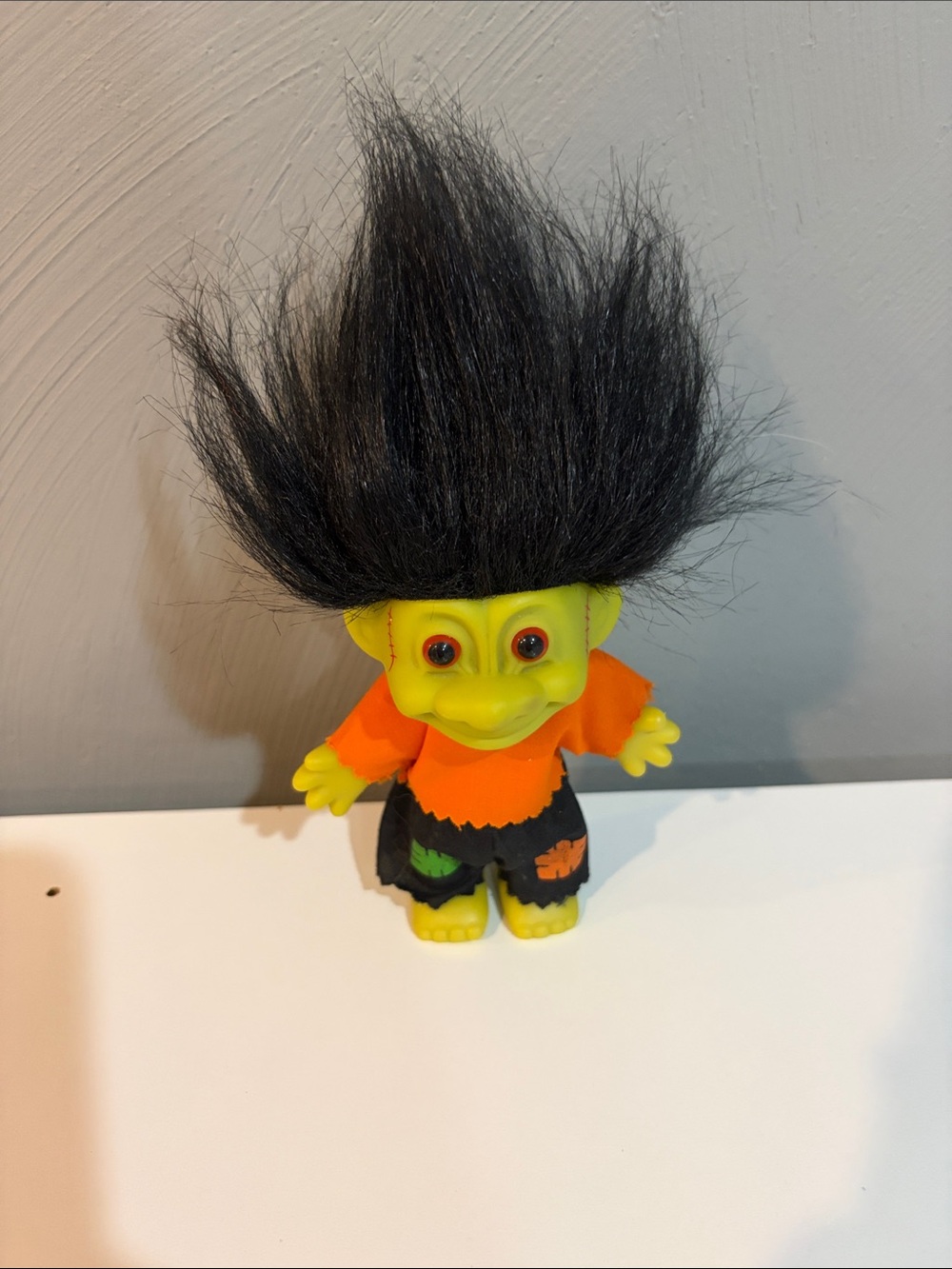 Russ Frankenstein Vintage Green Troll Doll with Black Hair and Orange Shirt